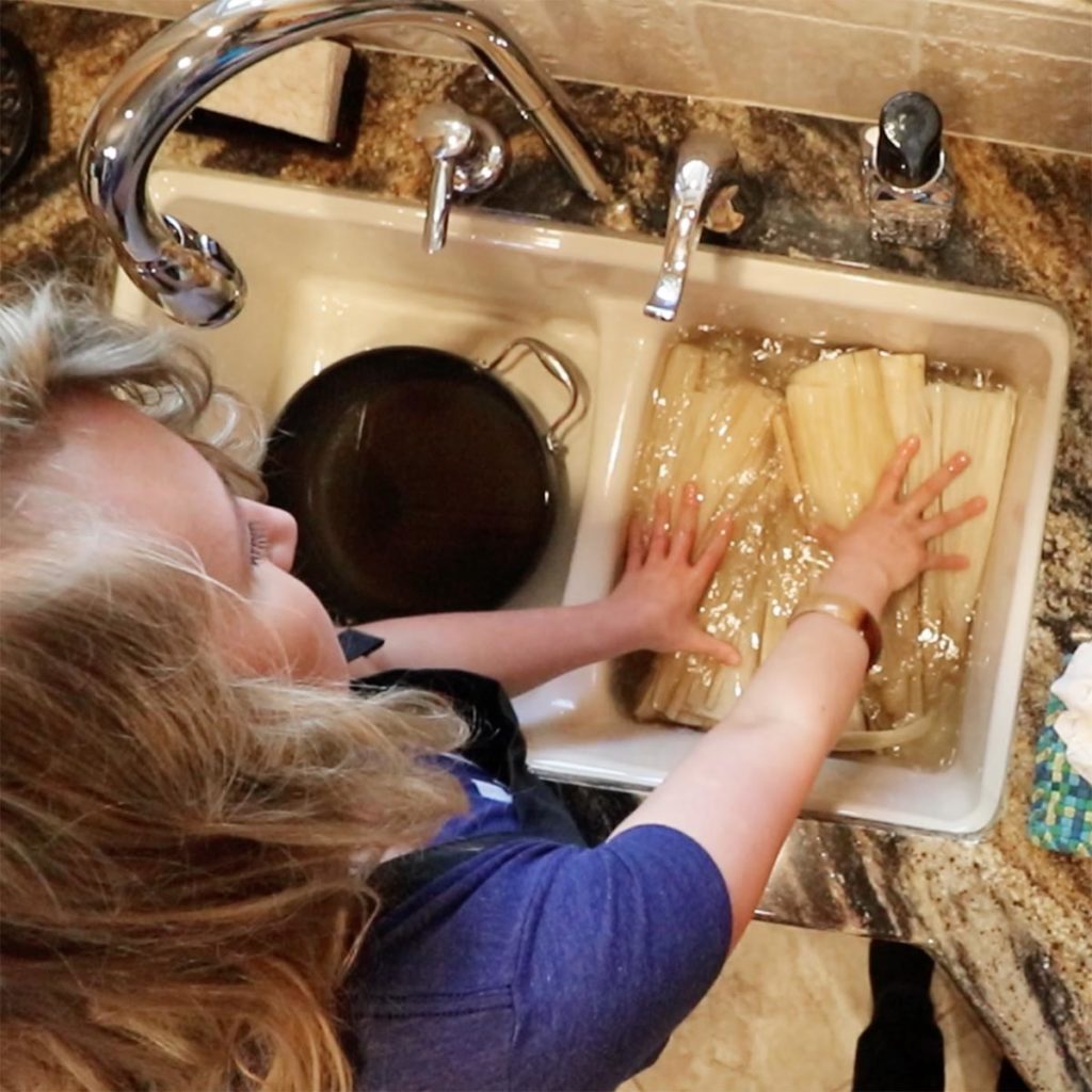 Pork Tamale Recipe - Erin Soaking Corn Husks